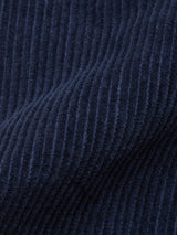 Close-up of Blue de Gênes Masami Cord Blazer - Navy fabric, highlighting its vertical corduroy ridges, soft texture, and deep navy hue. Garment-dyed for rich color and showcasing quality craftsmanship.