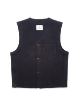 The Blue de Gênes Koi Wool Gilet in navy is a sleeveless, insulating wool vest with a V-neck, button front closure, and small chest pocket, shown laid flat on a white background.