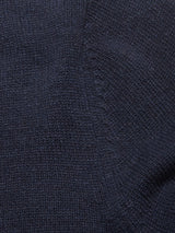 Close-up of the Nuvali Polo Cardigan - Navy by Blue de Gênes, showcasing its dark navy knit texture and visible vertical seam on the left side.