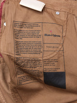 The Vinci Iro Pant in Chocolate by Blue de GĂȘnes features a printed label about Leonardo da Vinci, the brand logo, and VINCI JEANSâan ideal match for your regular fit jeans. Metal buttons and a clothing tag are also present.