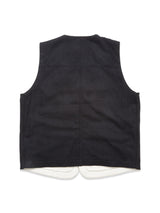 The Maurice Solid Gilet - Dark Navy by Blue de Gênes is shown from the back, highlighting its simple design with no visible buttons or pockets and a slightly curved white lining at the hem—an ideal tailored layering piece.