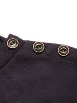 Close-up of the Blue de Gênes Toyama Knit L/S sweater in dark navy Merino wool, featuring three black buttons with metallic rims on the shoulder seam, set against a white background.