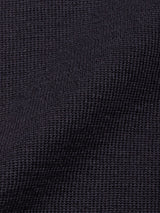 Close-up of the Blue de Gênes Toyama Knit L/S in Dark Navy reveals its textured waffle weave, creating subtle shadows and depth—ideal for a men’s lightweight sweater.