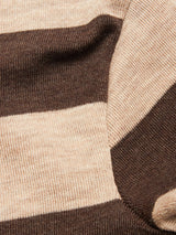 Close-up of the Blue de Gênes Toyama Stripe Knit L/S - Oat, featuring wide horizontal beige and brown stripes. Cozy merino wool texture and subtle folds showcase its comfort and style.