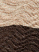 Close-up of the Toyama Stripe Knit L/S - Oat by Blue de Gênes, featuring a crewneck design with beige and dark brown horizontal stripes. The knit texture and threads are clearly visible.