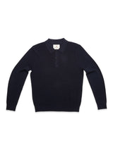 The Blue de Gênes Porto Polo Knit in navy is a long-sleeved sweater featuring a collar and four-button placket, shown laid flat on a white background for a stylish, casual look.