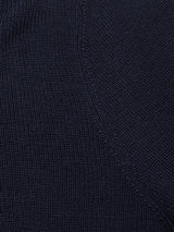 Close-up of the Porto Polo Knit - Navy by Blue de Gênes, highlighting its refined wool fabric, visible stitching, and subtle diagonal seam for a touch of casual elegance.
