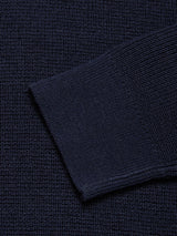 Close-up of the Porto Polo Knit - Navy by Blue de Gênes, featuring its deep navy knit fabric with a visible sleeve edge that highlights the refined texture and understated elegance.