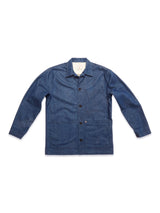 The Yuma Fano Jacket in Denim Blue by Blue de Gênes is a workwear-inspired heavy cotton blend piece with long sleeves, a collar, button-down front, and patch pockets, shown laid flat on a white background.