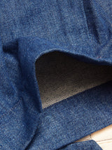 Close-up of Blue de GĂȘnes Shogun Fano Pant in Denim Blue, with the cuff turned up to reveal lighter inner fabric, detailed stitching, and the durable cotton blend construction.