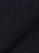 Close-up of the Otia L/S Polo Knit in Navy by Blue de Gênes, featuring a dark ribbed texture—ideal for a luxury long-sleeved knit polo shirt.