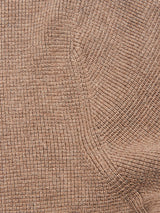 Close-up of the Gifu Knit Cardigan - Chocolate by Blue de Gênes, showing textured brown fabric with a ribbed, grid-like pattern and visible seams.