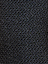 Close-up of the Nekutaki Tie #A - Navy by Blue de Gênes, featuring a dark, textured fabric with a raised diamond pattern that adds depth and subtle shine—ideal for a classic mens accessory.