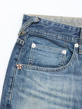Close-up of the front pocket and waistband of Blue de Gênes BGgiacomo Tim Jeans in antique wash, featuring visible stitching, metal rivets, and a small crest-shaped emblem above the coin pocket.
