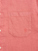 Close-up of the Blue de Gênes BGenric Hope L/S Shirt in Coral, featuring a chest pocket with an embroidered shield logo and white buttons—a breathable linen shirt ideal for warm summer days.