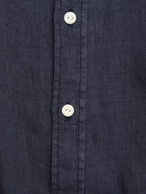 Close-up of the Blue de Gênes BGenric Hope L/S Shirt in dark navy, crafted from textured linen with a cut away collar and a stitched placket accented by a vertical row of white buttons.