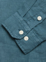 Close-up of the BGenric Hope L/S Shirt - Green Harvest by Blue de Gênes, featuring a textured green linen sleeve with two white cuff buttons and visible seam details—ideal for breathable summer wear.