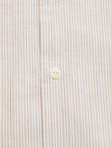Close-up of the BGbasso Meco Shirt - Beige Stripe by Blue de Gênes, made in Portugal from 100% cotton, showcasing beige and white stripes, a cream button, and detailed fabric texture with visible stitching.