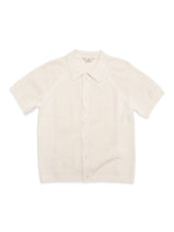 The BGbilly S/S Cardigan - Chalk by Blue de Gênes is a vintage-inspired, cream short-sleeved cardigan with a collared neckline, front buttons, and a textured perforated 100% cotton design.