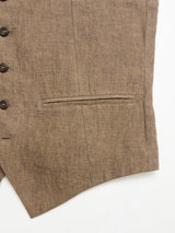 Close-up of the BGcanna Lin Gilet in Grey Mel by Blue de Gênes, featuring black buttons and a single welt pocket on the right side, shown against a white background.