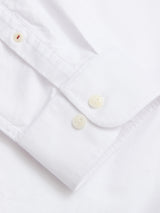 Close-up of the BGsander Oxford Shirt - White by Blue de Gênes, showing the crisp 100% cotton fabric, neat stitching, and two white buttons on the cuff.
