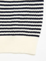 Close-up of the Blue de Gênes BGbob Knit Polo - Navy, featuring horizontal navy and white stripes with a solid white ribbed hem for a classic nautical look.