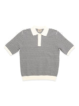 The BGbob Knit Polo - Navy by Blue de Gênes features thin black and white stripes, a cream collar and cuffs, short sleeves, and a partial button placket for a classic yet nautical cotton knit look.