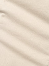 Close-up of Blue de Gênes BGpaulo Pavia 1 V2 Chino in Ecru, featuring beige cotton stretch fabric with a vintage military look, visible texture, and subtle diagonal creases.