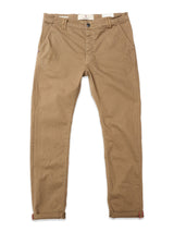 The Paulo Pavia 1 V2 Chino in Fudge by Blue de Gênes features front pockets, belt loops, a button and zip closure, tapered cotton stretch legs with red cuff accents, and is shown flat on a white background.