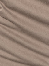 Close-up of BGpaulo Pavia 1 V2 Chino - Fungi by Blue de Gênes: light brown cotton stretch fabric with visible diagonal creases and a soft, slightly textured surface—perfect for chino pants.