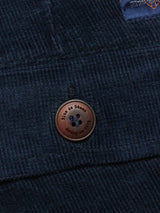 Close-up of a dark navy, textured corduroy with Blue de Gênes engraved on a brown button, exuding cross-cord comfort, ideal for crafting Albi Cargo Pant by Blue de Gênes.