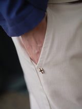 Wearing BGpalco Twill Pants - Chalk by Blue de Gênes, featuring a relaxed fit and a small cross pin near the pocket, hand tucked in, paired with a Blue de Gênes shirt.