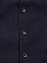 Close-up of three Buffalo horn buttons on Blue de Gêness Canna Carbonio Gillet in Dark Navy Italian brushed cotton, arranged vertically with buttonholes. The subtle texture exudes formality, ideal for a jacket or coat.