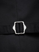 Close-up of a dark navy fabric strap from the Canna Carbonio Gillet by Blue de Gênes, featuring a silver rectangular buckle with rounded edges. The texture resembles Italian brushed cotton, and the buckle is centrally secured on this adjustable strap.