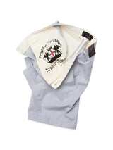 Elak Riga Shorts in blue stripe by Blue de Gênes are crafted from fine line cotton, featuring an open waistband with the brands logo and Progett. heritage inside. These relaxed regular fit shorts come with Corozo nut buttons and are displayed on a white background.