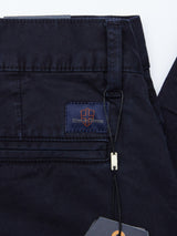 Close-up of the back pocket area of navy Franco Genes Chino by Blue de Gênes, made from durable garment-dyed Saia twill with a stitched Blue Jeans logo patch. A black string and tag on a belt loop accentuate the texture of these stylish chinos.