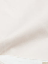 A close-up of the BGpalco Twill Pants in Chalk by Blue de Gênes, featuring relaxed fit cotton twill fabric with fine diagonal lines and stitching detail near the bottom edge.