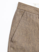 Close-up of Blue de Gênes BGpalco Lin Pants in Grey Mel, showing the waistband and front pocket details, with a white clothing tag partially visible at the top.
