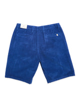The BGfloyd Cord Shorts - Navy Peony by Blue de Gênes are loose fit corduroy shorts shown from the back, with two buttoned back pockets and a white waistband tag, laid flat on a white background.