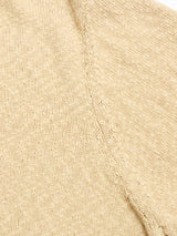 Close-up of the BGjohn Slubby Polo in Pale Khaki by Blue de Gênes, highlighting the textured beige cotton knit fabric with visible stitches and seam details.