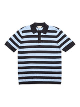 The BGwally Stripe Polo - Dark Navy by Blue de Gênes is a cotton-linen knit polo with horizontal black and light blue stripes, a black collar, and a three-button placket, combining comfort and classic style.