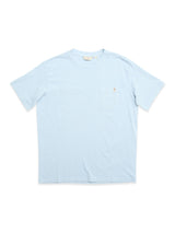 The BGoscar T-Shirt - Blue Fog by Blue de Gênes is made from 100% cotton, with short sleeves, a crewneck, and a small left chest pocket with an embroidered detail. Displayed flat on a white background.