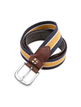 The Blue de Gênes BGcollege Belt - Navy Stripe features navy, yellow, and white stripes, Blue de Gênes-inspired leather tips with a silver buckle, and an embroidered cross emblem on the leather.