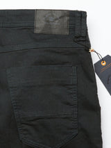 Close-up of the back pocket and waistband of jet black Paulo Pavia 1 Chino pants by Blue de GĂȘnes. Crafted in Italy with premium cotton stretch fabric, they feature prominent stitching, leather brand patch, and a tag on the belt loop with visible text.