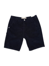 The BGfloyd Cord Shorts by Blue de Gênes in dark navy are soft cotton, loose-fit corduroy shorts with belt loops, front pockets, a button closure, and a small logo on the left pocket, shown laid flat on a white background.