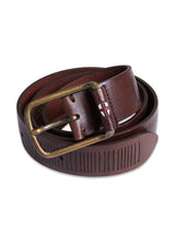 The Obla Belt by Blue de Gênes is a coiled, dark brown full-grain leather belt with an antique brass buckle. Handmade with engraved lines and a small emblem near the buckle, it exudes unique charm.