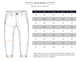 The Blue de Gênes Panco Dori Chino in Grey stripe features an illustrated size chart for relaxed fit across sizes 28-38, showing waist, thigh, knee, and hem measurements in centimeters. The image with an irregular pinstripe pattern marks measuring points; note the variability of cotton material.