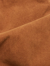 Close-up of the Biscotto Paulo Tucan Chino by Blue de Gênes, showcasing Italian-made comfort stretch corduroy with visible ridges and a soft texture, creating gentle folds and shadows.