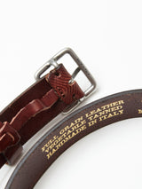 The Pento Belt - Brown by Blue de Gênes showcases premium craftsmanship with a silver buckle and yellow text reading FULL GRAIN LEATHER VEGETABLE TANNED HANDMADE IN ITALY, highlighting the top-quality full grain bull leather and meticulous Italian artistry.