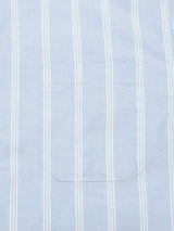 Close-up of the Sandro Caicos Shirt by Blue de Gênes, featuring 6oz fine light blue stripe fabric with vertical white stripes and a seamlessly aligned pocket. Expertly crafted in Oxford style by Somelos in Portugal, this piece exemplifies elegance and precision.